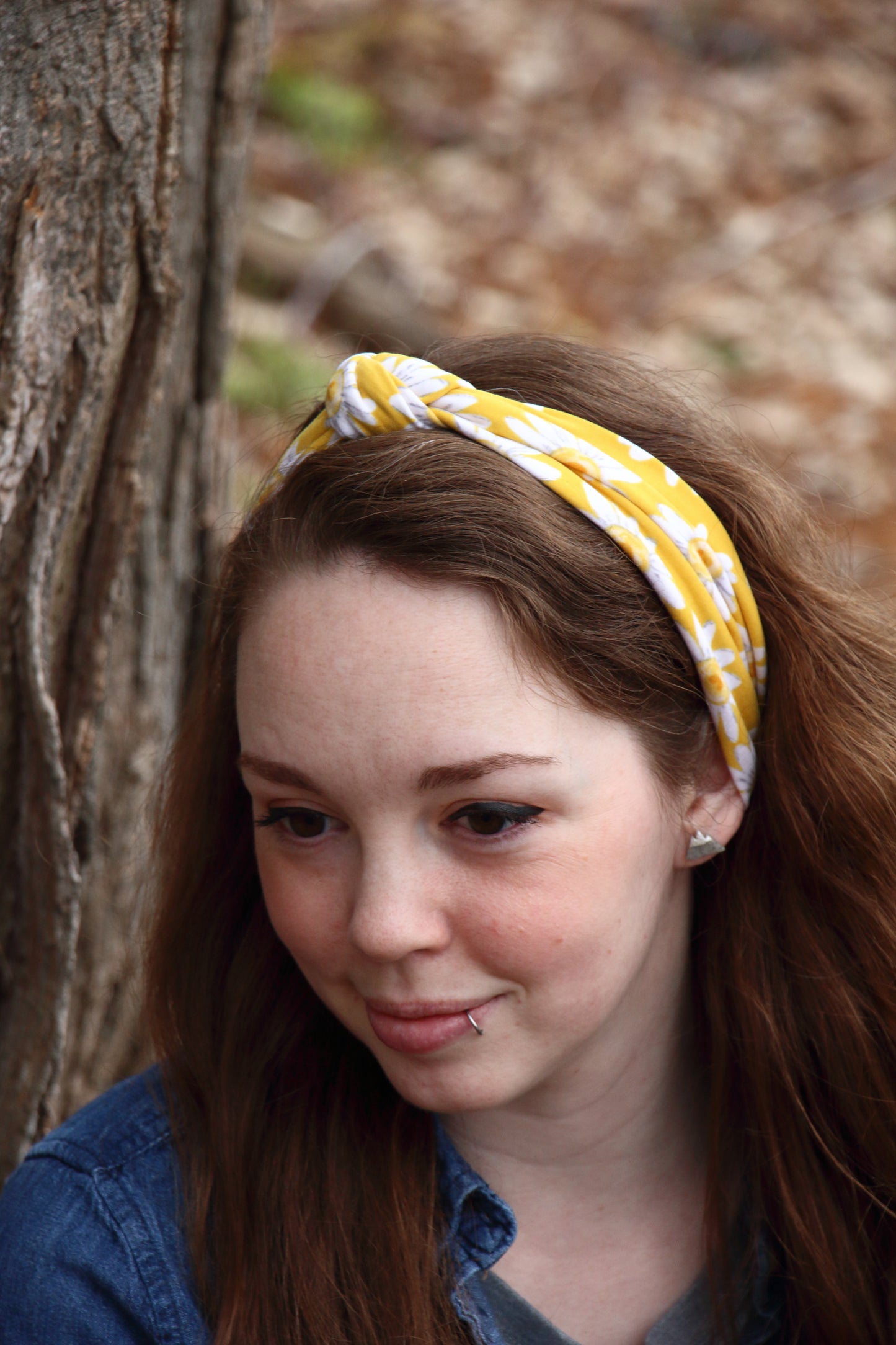 woman wearing a yellow floral knotted headband